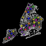 A map of New York City with glowing lights representing the NYC Grid System.
